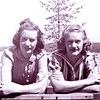Pris, Lorraine, Alice, Marie, leaning over a bench, in 1940s